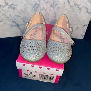 Kids size 12 silver shoe.
